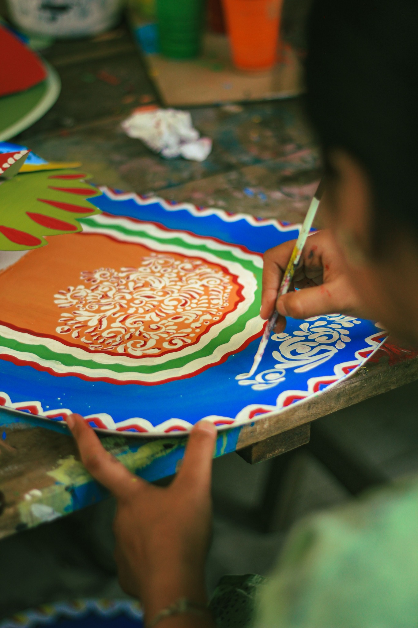 Bangladeshi artisan painting a handcrafted item